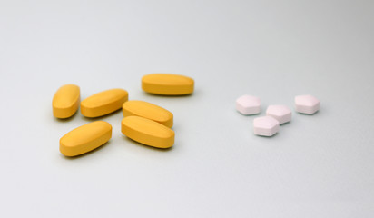 Six yellow pills and four white pills.