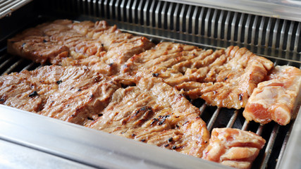 Burn meat from charcoal grill. 