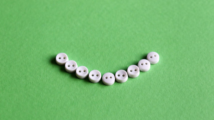 White button on the light green background.