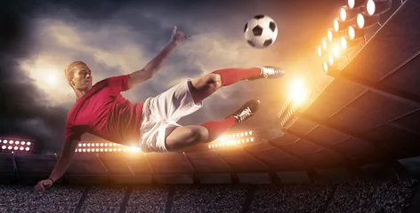 Zelfklevend Fotobehang Soccer player in action on stadium background. © efks