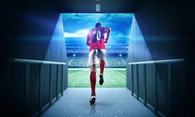 Fotobehang Voetbal Voetballer die het 3d denkbeeldige stadion binnengaat