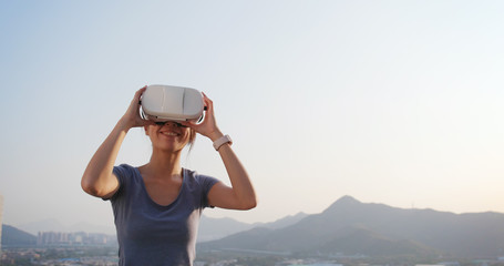 Woman playing VR at outdoor