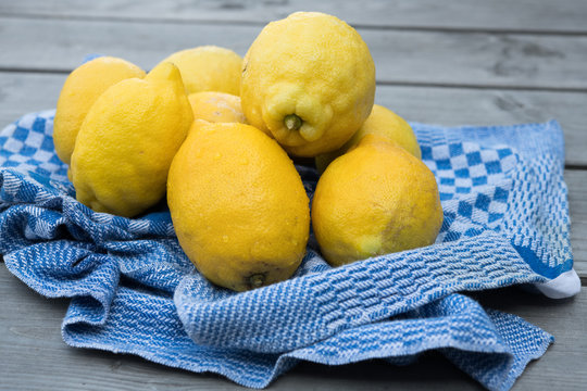 yellow lemons with blue towel