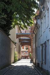 Narrow street in the medieval old town of Lubeck, Germany