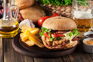 Chickenburger with bacon, tomato, cheese and lettuce