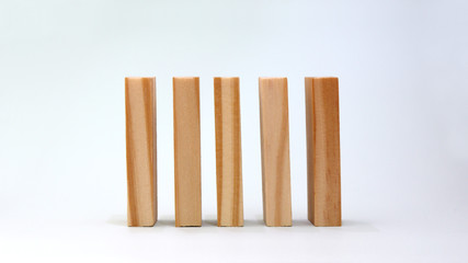 Five wooden blocks lined up.