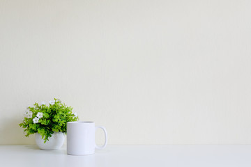 Workspace with coffee cup and tree decoration
