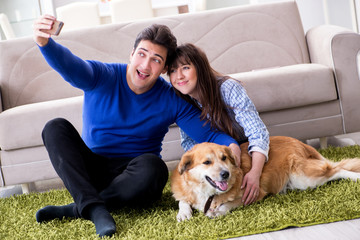 Happy family with golden retriever dog