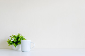 Workspace with coffee cup and tree decoration