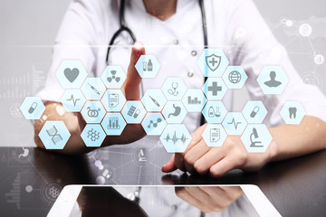 Medical doctor working with modern computer virtual screen interface. Medicine technology and healthcare concept. EMR, EHR, Electronic Health Records.