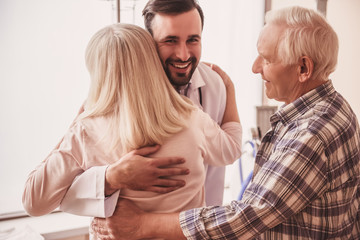 Fototapeta premium Old couple and doctor