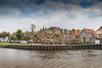 Fototapeta na wymiar neighborhood on a canal in the city of Alkmaar. netherlands holland