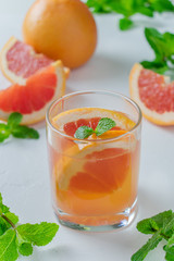 Grapefruit water in a glass with mint