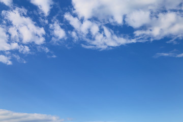 Naklejka na ściany i meble Blue sky with white clouds, space for text