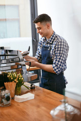 Barista At Cafe. Man Working In Coffee Shop