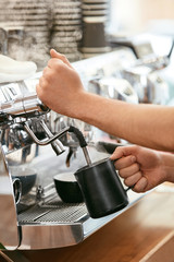 Barista Preparing Coffee On Coffee Machine