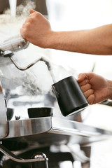 Barista Preparing Coffee On Coffee Machine