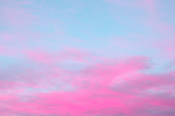 bright pink clouds on a blue sky at the sunset