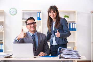 Man and woman working in the office