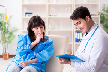 Fototapeta premium Doctor discussing blood transfusion with patient