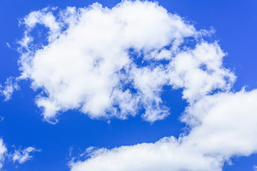 White fluffy clouds in a deep blue sky