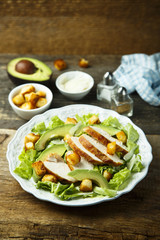 Grilled chicken Caesar salad with avocado