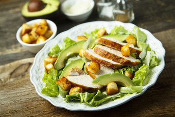 Grilled chicken Caesar salad with avocado