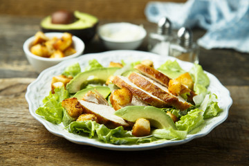 Grilled chicken Caesar salad with avocado