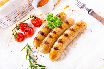 delicious bratwurst with ketchup and fresh rolls