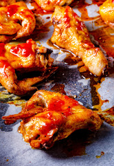 Rustic backed chicken wings,legs on baking tray