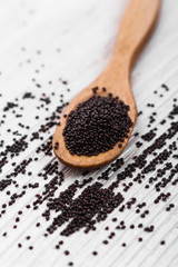 fresh amaranth grains on a rustic background