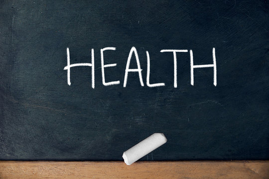 Health text title, hand writing  with chalk on black board