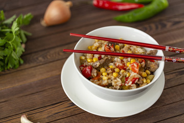 Delicious homemade wok fried rice with meat and vegetables
