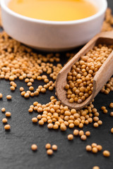 fresh mustard oil on a rustic background