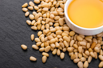 fresh cedar nut oil on a rustic background