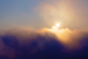 Naklejka na ściany i meble Beautiful morning clouds with sun. Morning landscape in fog.