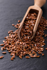 flaxseed and oil on a rustic background