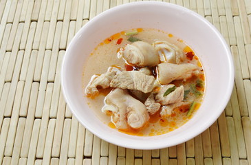 spicy boiled pork leg in Tom Yum soup on bowl
