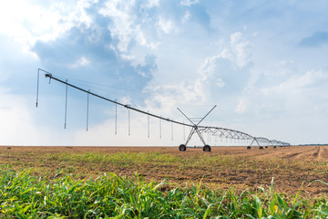 Fototapeta na wymiar large irrigation systems on wheels, ready in the field