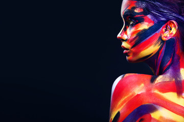 Portrait of the bright beautiful girl with art colorful make-up and bodyart