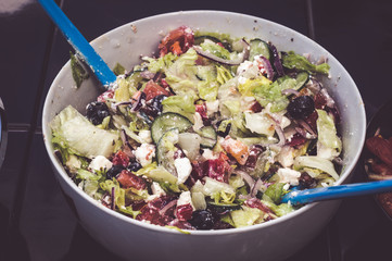 Fresh mixed vegetables salad in a bowl. Selective dark focus