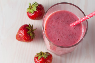 Glasses of milkshakes with chocolate, strawberry, banana flavor, with ice cream on wooden blue and white background. Sweet drinks for summer concept. Shakes and smoothies. Milk shake and cocktail.