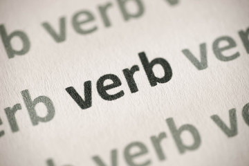 word verb printed on paper macro