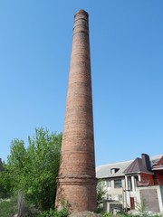 Brick factory chimney. The boiler plant. Smokestack boiler.