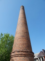 Brick factory chimney. The boiler plant. Smokestack boiler.