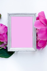 Pink peony flower in frame Flat lay Nature concept on white background with copy space for greeting message creative layout. Mother's Day and spring background concept.