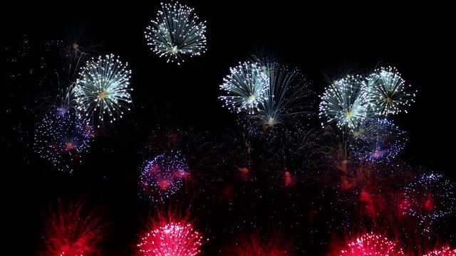 Colorful fireworks exploding in the night sky. Celebrations and events in bright colors.