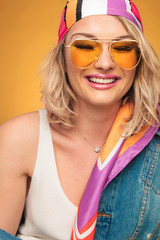 close up of rock woman with yellow sunglasses laughing