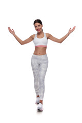 sexy fitness woman stepping with a welcoming gesture