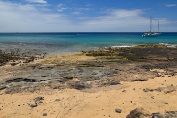 A beautiful coastline of the Atlantic ocean with sailboats in Morro Jable Fuerteventura- Canary Islands